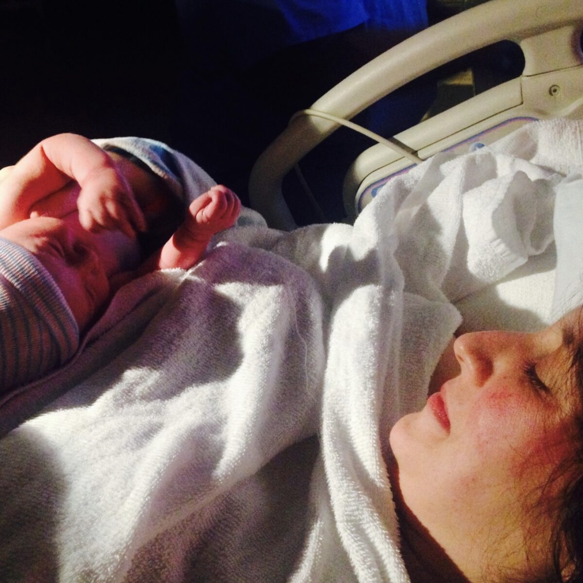 The author stares at her newborn baby minutes after birth.