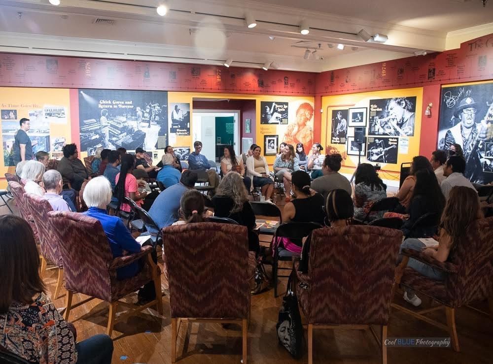 Group of people in chairs.